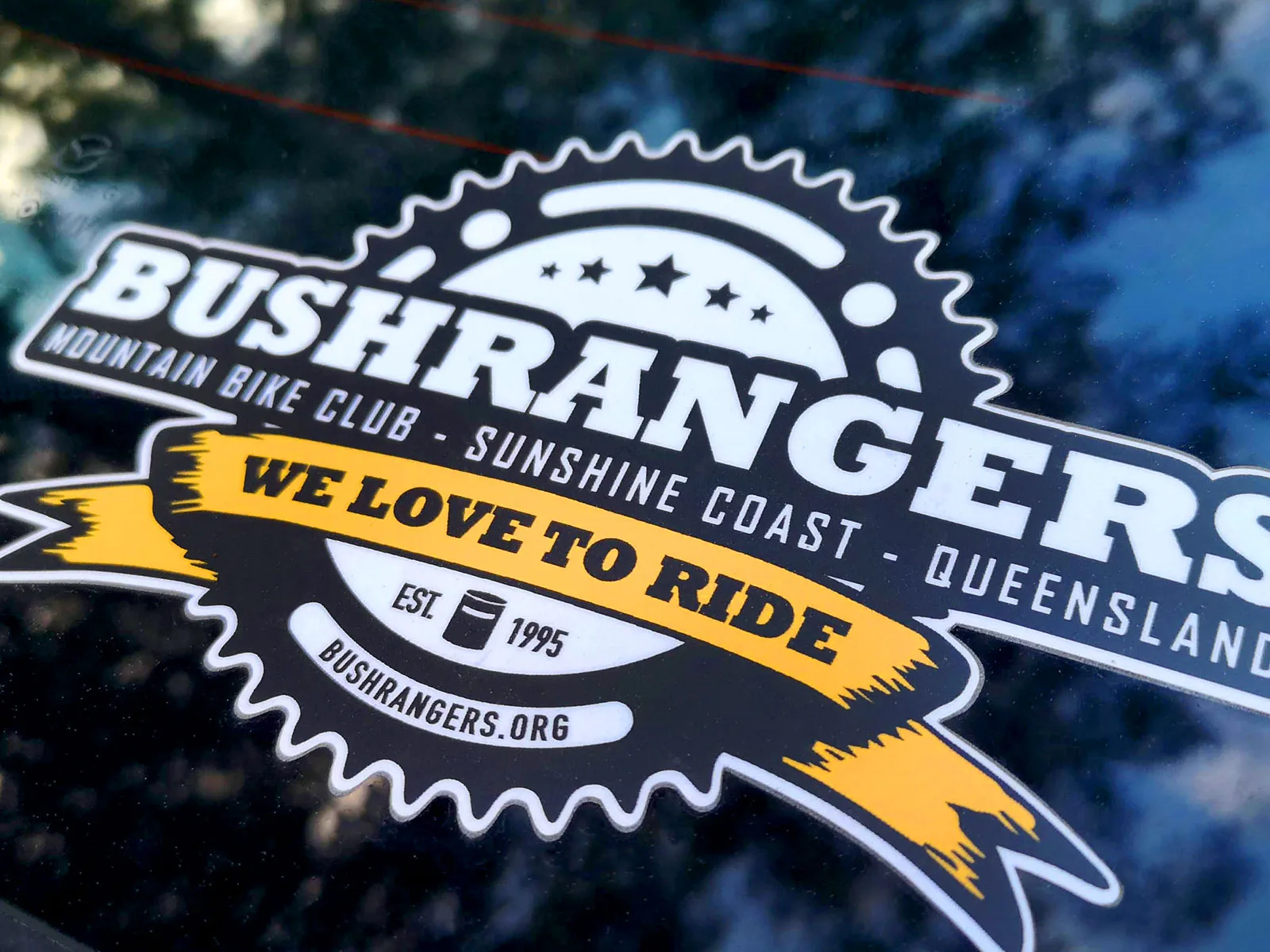 Photo of a Bushranger Club sticker stuck to a car's windscreen